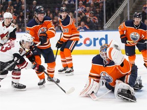 Edmonton's goaltender Mikko Koskinen (19) stops Arizona's Conor Garland (83) during the first period of a NHL hockey game at Rogers Place in Edmonton, on Monday, Nov. 4, 2019.