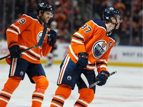 Edmonton Oilers' Connor McDavid (97) celebrates a goal with Leon Draisaitl (29) on Arizona Coyotes' goaltender Darcy Kuemper (35) during the first period of a NHL hockey game at Rogers Place in Edmonton, on Monday, Nov. 4, 2019.