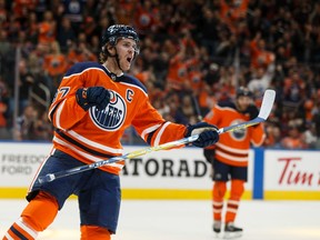 Edmonton Oilers' Connor McDavid (97) celebrates a goal on Colorado Avalanche's goaltender Adam Werner (30) during the first period of a NHL hockey game at Rogers Place in Edmonton, on Thursday, Nov. 14, 2019.