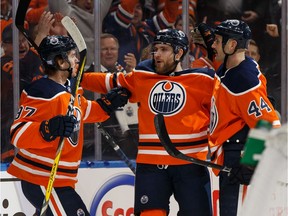 Edmonton Oilers' Zack Kassian (44) celebrates a goal with teammates on Colorado Avalanche's goaltender Adam Werner (30) during the first period of a NHL hockey game at Rogers Place in Edmonton, on Thursday, Nov. 14, 2019.