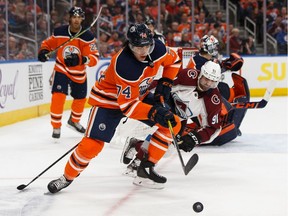 Edmonton Oilers defenceman Ethan Bear battles Colorado Avalanche forward Nazem Kadri during the second period of a NHL hockey game at Rogers Place in Edmonton on Nov. 14, 2019.