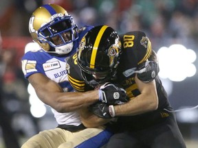 Hamiton receiver Jaelin Acklin is tackled in the third qurarter during the 107th Grey Cup CFL Championship football game in Calgary at McMahon Stadium Sunday, November 24, 2019.