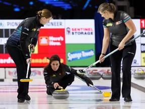 Skip Cheryl Bernard (centre), with Team Scheidegger, shoots alongside second Jessie Haughian (left) and lead Kristie Moore during a game with Team during the 2019 Home Hardware Canada Cup play at Sobey's Arena in the Leduc Recreation Centre in Leduc, on Wednesday, Nov. 27, 2019.