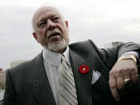 Canadian hockey commentator Don Cherry speaks to journalists on Parliament Hill in Ottawa November 7, 2006.    REUTERS/Chris Wattie   (CANADA) ORG XMIT: OTW04