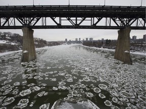 Ice begins to form and float down the North Saskatchewan River under the High Level Bridge, in Edmonton Tuesday Nov. 12, 2019.