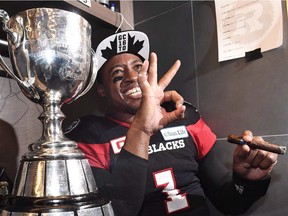 Ottawa Redblacks quarterback Henry Burris (1) and 10-year-old son, Armand, celebrate the Redblacks Grey Cup win over the Calgary Stampeders in Toronto on Sunday, November 27, 2016. Veteran CFL quarterback Burris is retiring.