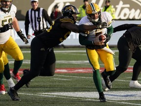 Nov 17, 2019; Hamilton, Ontario, CAN; Hamilton Tiger-Cats defensive lineman Ja'Gared Davis (56) sacks Edmonton Eskimos  quarterback Trevor Harris (7) during the CFL Eastern Conference Final football game  at Tim Hortons Field. Mandatory Credit: John E. Sokolowski-USA TODAY Sports ORG XMIT: USATSI-421954