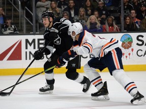 Los Angeles Kings left wing Dustin Brown (23) moves in for a shot on goal against Edmonton Oilers defenseman Darnell Nurse (25) during the second period at Staples Center.