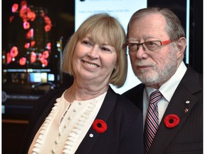 Edmonton philanthropists Dianne and Irving Kipnes stand in front of a poppy display on Nopv. 7, 2019, that will be projected onto the National Arts Centre in Ottawa on Remembrance Day, thanks to the Kipnes Lantern which is named after them.