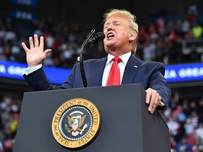U.S. President Donald Trump gestures as he speaks during a rally at Rupp Arena in Lexington, Ky., on Nov. 4, 2019.