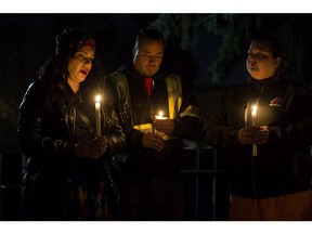 Robin Buglar (left) attends a candle light vigil for her sister Rebecca Hunter, in Edmonton Wednesday Nov. 20, 2019. Photo by David Bloom