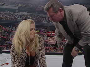 Vince McMahon ordering Trish Stratus to "bark like a dog."