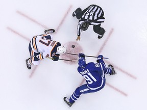 TORONTO, ON - FEBRUARY 27:  Connor McDavid #97 of the Edmonton Oilers takes a faceoff against John Tavares #91 of the Toronto Maple Leafs during an NHL game at Scotiabank Arena on February 27, 2019 in Toronto, Ontario, Canada. The Maple Leafs defeated the Oilers 6-2.