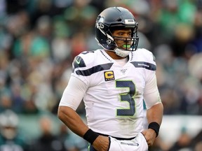 Russell Wilson of the Seattle Seahawks looks to the bench during a stop in play in the third quarter against Philadelphia Eagles at Lincoln Financial Field on November 24, 2019 in Philadelphia, Pennsylvania.