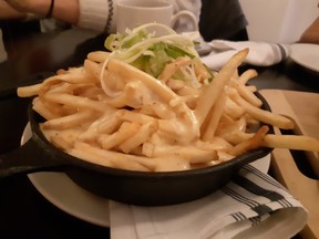 The Brasserie Bardot calls this combination of poutine with fondue cheeses a "fontine."  PHOTOS BY GRAHAM HICKS / EDMONTON SUN