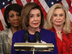 Speaker of the House Rep. Nancy Pelosi (D-CA) (C) speaks as Chairwoman of House Financial Services Committee Rep. Maxine Waters (D-CA) (L) and Chairwoman of House Oversight and Reform Committee Rep. Carolyn Maloney (D-NY) (R) listen during a news conference at the U.S. Capitol December 10, 2019 in Washington, DC.
