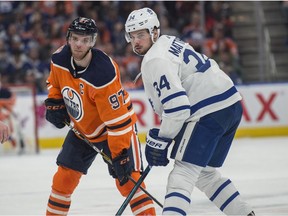Connor McDavid (97) of the Edmonton Oilers, faces off with Auston Matthews (34) of the Toronto Maple Leafs at Rogers Place in Edmonton on March 9, 2018.