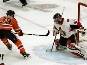 Edmonton Oilers Alex Chiasson (left) scores on Ottawa Senators Craig Anderson during first period NHL game action in Edmonton on Saturday March 23, 2019.