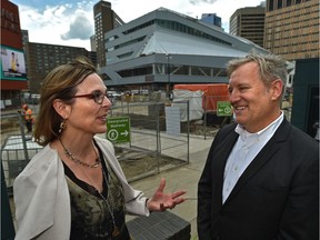 Pilar Martinez (L), Edmonton Public Library CEO and city architect Carol Belanger in front of the downtown library still under construction in Edmonton,July 16, 2019. Ed Kaiser/Postmedia