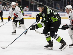 Edmonton Oil Kings' Jake Neighbours, (21) skates past Moose Jaw Warriors' Ryder Korczak (38) during the second period of a WHL hockey game at Rogers Place in Edmonton, on Tuesday, Dec. 3, 2019. Photo by Ian Kucerak/Postmedia