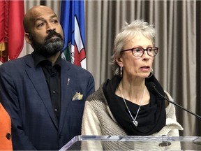 NDP Opposition health critic David Shepherd, left, with Heather Waldie, a 63-year-old woman who has concerns about the lack of information about changes to the Alberta Seniors Drug Benefit Program, at the Federal Building in Edmonton on Tuesday, Dec. 10, 2019.