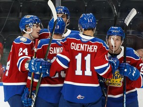 Edmonton Oil Kings' Jake Neighbours (21) celebrates a goal with teammates on Swift Current Broncos' goaltender Isaac Poulter during first period WHL hockey action at Rogers Place in Edmonton, on Wednesday, Dec. 11, 2019. Photo by Ian Kucerak/Postmedia