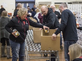 About 40 volunteers packed 1300 hampers, on December 12, 2019, for the Christmas Bureau in the gym of St. Francis of Assisi Elementary School for delivery to families in need on Saturday.