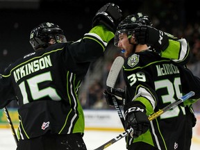 Edmonton Oil Kings' Ethan McIndoe (39) celebrates a goal with teammates on Swift Current Broncos' goaltender Isaac Poulter during second period WHL hockey action at Rogers Place in Edmonton, on Friday, Dec. 13, 2019. Photo by Ian Kucerak/Postmedia