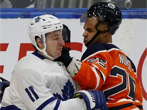 Toronto Maple Leafs winger Zach Hyman, left, and Edmonton Oilers defenceman Darnell Nurse tangle during NHL game action in Edmonton on Saturday, Dec. 14, 2019.