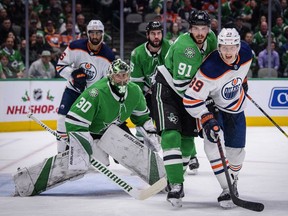 Dallas Stars goaltender Ben Bishop (30) and center Tyler Seguin (91) defend against Edmonton Oilers right wing Alex Chiasson (39) during the first period at the American Airlines Center.