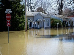 A street is submerged in flood waters in the Montreal suburb of Sainte-Marthe-sur-le-Lac, Que., on April 29, 2019.