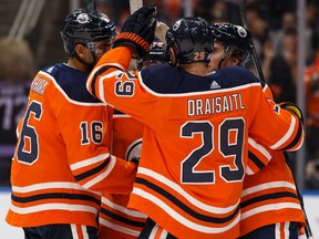 Edmonton Oilers' Ethan Bear (74) celebrates a goal with teammates on Dallas Stars' Anton Khudobin (35) during the second period of a NHL hockey game at Rogers Place in Edmonton, on Saturday, Nov. 16, 2019. Photo by Ian Kucerak/Postmedia