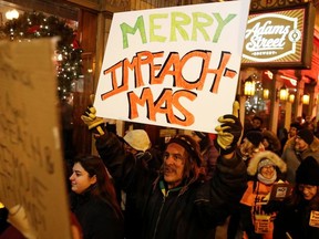 Protesters take part in a rally to support the impeachment and removal of U.S. President Donald Trump in Chicago, Illinois, U.S. December 17, 2019.