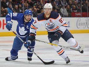 Connor McDavid of the Edmonton Oilers skates against John Tavares of the Toronto Maple Leafs during an NHL game at Scotiabank Arena on Jan. 6, 2020 in Toronto. (Claus Andersen/Getty Images)