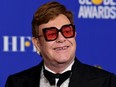 Elton John poses in the press room with the award for Best Original Song - Motion Picture during the 77th Annual Golden Globe Awards at The Beverly Hilton Hotel on January 05, 2020 in Beverly Hills, California.