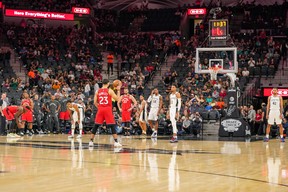 Fans cheer in honour of Kobe Bryant as the San Antonio Spurs and Toronto Raptors let the shot clock expire on each their respective first possessions during Sunday's game. (USA TODAY SPORTS)