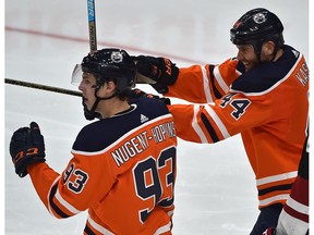 Edmonton Oilers Ryan Nugent-Hopkins (93) and Zack Kassian (44) celebrate a teammate's goal against the Arizona Coyotes at Rogers Place on Feb. 19, 2019.
