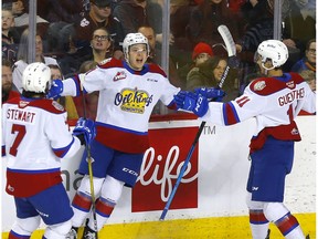 Edmonton Oil Kings forward Jake Neighbours celebrates his goal with teammmates Dylan Guenther, right, and Samuel Stewart in first period against the Calgary Hitmen at the Scotiabank Saddledome in Calgary on Monday, December 30, 2019.