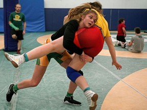 Aleah Nickel (left) and Vianne Rouleau (right) participate in a University of Alberta Golden Bears and Pandas wrestling practice on Tuesday, January 7, 2020. The university wrestling squads are holding their annual invitational as part of a dual meet this weekend, beginning with facing the University of Calgary on Friday January 10 before the invitational gets underway on Saturday January 11.