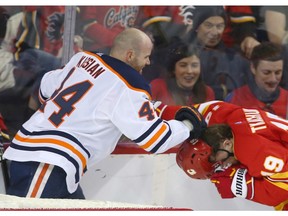 Oilers Zack Kassian and Flames Matthew Tkachuk battle in the second period during NHL action between the Edmonton Oilers and the Calgary Flames in Calgary on Saturday, January 11, 2020.