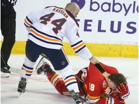 Oilers Zack Kassian and Flames Matthew Tkachuk battle in the second period during NHL action between the Edmonton Oilers and the Calgary Flames in Calgary on Saturday, January 11, 2020.