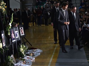 Prime Minister Justin Trudeau and Alberta Premier Jason Kenney attend the public memorial service to remember victims of last week's airliner crash outside Tehran, Iran, at the Saville Community Sports Centre in Edmonton on Sunday, Jan. 12, 2020.