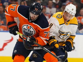 Edmonton Oilers' Oscar Klefbom (77) battles Nashville Predators' Kyle Turris (8) during second period NHL hockey action at Rogers Place in Edmonton, on Tuesday, Jan. 14, 2020.