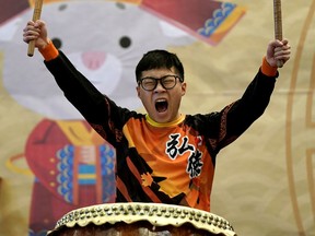 Nolan Chan, a member of the Hong De Cultural and Athletic Association, celebrates the upcoming Lunar New Year while banging the drum at the 2020 Chinese New Year Carnival held in Edmonton at the Chinese Catholic Parish on the weekend. The new year (Year of the Rat) starts on January 25, 2020.