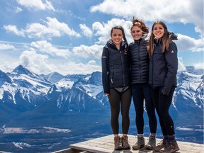 Nicole Palladino, centre, pictured with Rowan Lumb, left, and Sapphire Kroetsch, was paralyzed Jan. 14 while riding a bicycle on vacation in Costa Rica. A Go Fund Me page created to help facilitate the rehabilitation process reached its initial target of $100,000 by the second day. (Supplied)