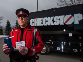 Cst. Andrew Fairman, with the Calgary Police Service Alcohol and Drug Recognition Unit, shows a roadside breath-screening device on Thursday, January 30, 2020. The Calgary Police Service announced it is expanding mandatory alcohol screening in the city.