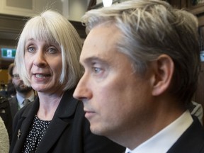 Foreign Affairs Minister Francois-Philippe Champagne looks on as Minister of Health Patty Hajdu responds to a question as they speak with the media about coronavirus, Wednesday, January 29, 2020 in Ottawa.