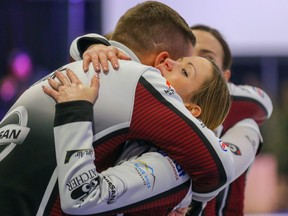 Edmonton skip Laura Walker celebrates with her coach Brian Chick after winning the Alberta Scotties Tournament of Hearts against team Kelsey Rocque in Okotoks, Alberta on Sunday, January 26, 2020.