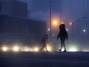Pedestrians make their way through the extreme cold in downtown Edmonton, Wednesday, Jan. 15, 2020.