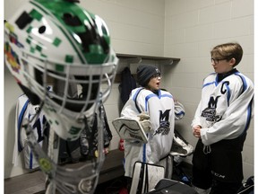 Millwoods Bruins' Michael Whittington (left) and Zak Tkachuk talk strategy prior to the opening game of last year's Quikcard Edmonton Minor Hockey Week against the Ice Guardians at the Meadows Community Recreation Centre in this file photo from Jan. 9, 2019.